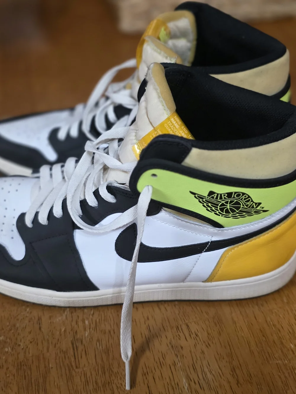 Jordan Men’s High-Top Sneakers in Black, White & Yellow Tongue